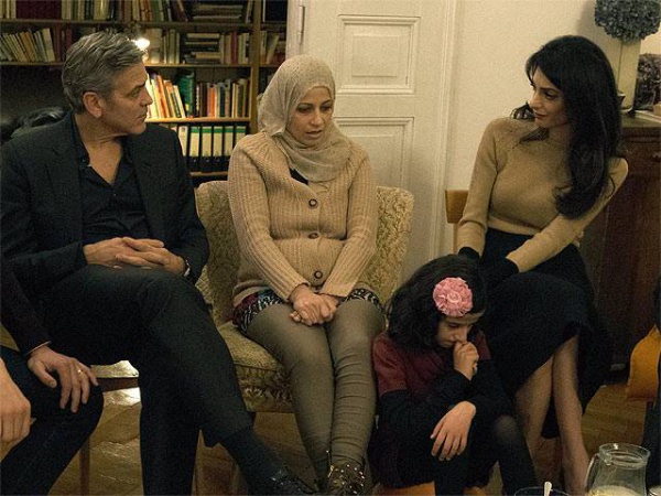 Джордж и Амаль Клуни на встрече с беженцами.